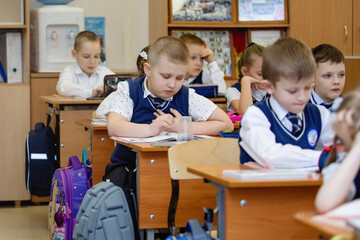 Pupils at desks in class on lesson