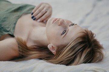 Portrait of beautiful young woman from unusual angle