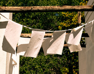 Old White Flags Hanging Outside