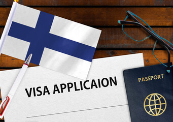 Flag of Finland , visa application form and passport on table