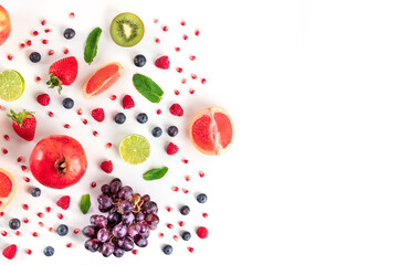 Fresh fruit, shot from the top on a white background, a flat lay with copy space