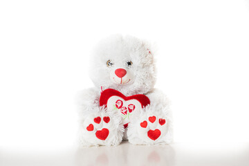 teddy bear with heart shape gift on white background