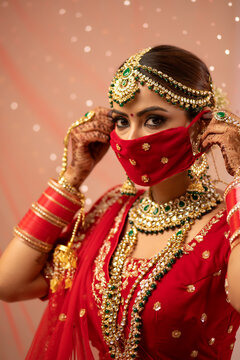 Indian bride wearing a mask	