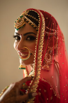 Smiling Indian Bride looking at the camera with a smile	