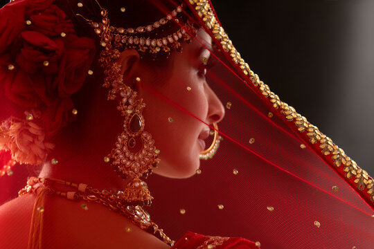 Smiling Indian Bride looking at the camera with a smile	