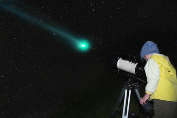 A child is watching a comet through a telescope.