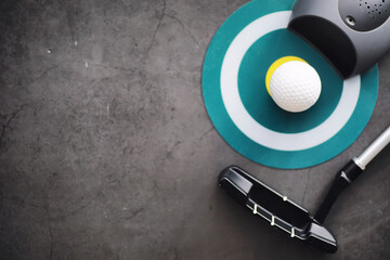 Sport and healthy lifestyle. Mini golf. White golf ball and set for minigolf on the table. Sports background with golf concept.