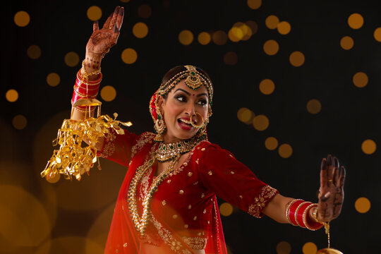 Indian bride dancing at her wedding	