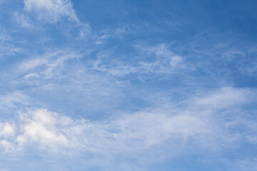 White clouds against the blue sky. Background image.