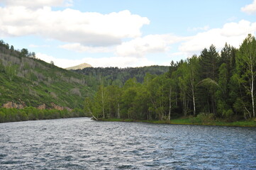 Fototapeta premium Ridder, Kazakhstan - 06.05.2013 : The Irtysh River, which flows along a mountainous and hilly area with different vegetation.