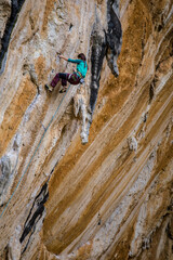 The girl climber climbs.
