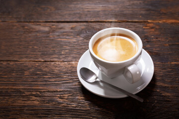 cup of coffee on a wooden table