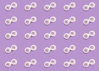 Containers with contact lenses on color background