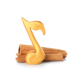 Music note and cinnamon on white background