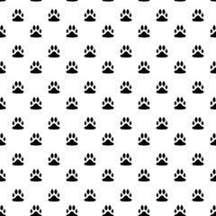 Seamless pattern with black paw prints on a white background
