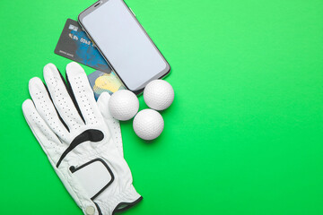 Credit cards, mobile phone, golf glove and balls on color background. Concept of sports bet