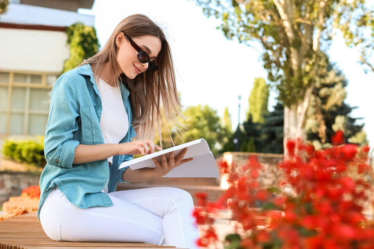 Beautiful Woman Reading Blank Magazine Outdoors