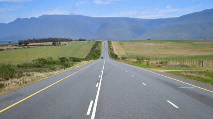 Road in scenic countryside landscape, driving trip to Cape Town, highway in South Africa