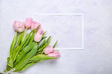 Frame with beautiful flowers on light background