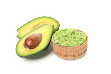 Bowl of guacamole and avocado isolated on white background
