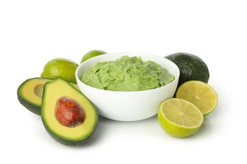 Bowl of guacamole, avocado and lime isolated on white background
