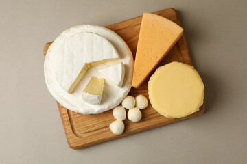 Different fresh dairy products on gray background
