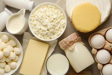 Different fresh dairy products on gray background, top view