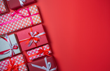 Gift boxs with bow on red background top view, Valentines day, Flat lay style with copy space.