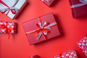 Gift boxs with bow on red background top view, Valentines day, Flat lay style with copy space.