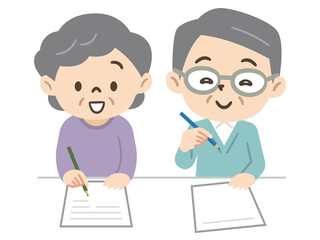 Obraz premium 書類を書くシニア夫婦