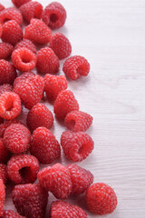 Summer berries food closeup.Fresh raspberries on a wooden background. Top view