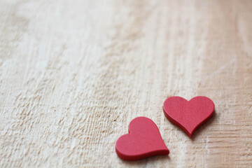 Two red Hearts for Valentine`s day concept on wood background. Love background