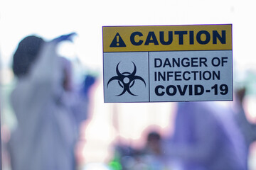 Anti-virus sign affixed to the glass door