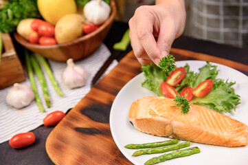 Fresh Salmon steak with salad. Online learning for cooking diet and healthy food when stay at home...