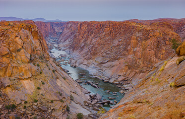 Landscape with the gorge of the Orange river in Augrabies National Park, South-Africa before sunrise