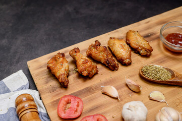 Homemade Barbecue chicken wings with BBQ marinade and dipping sauce. Cooking at home on winter...