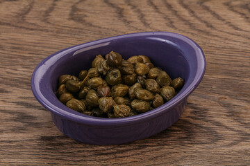 Tasty capers in the bowl
