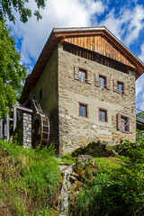 Ancient watermill in the Dolomites mountains © Antonio