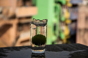 Raw lemon falling deeply under water with splash on blur background.