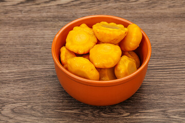 Marinated yellow patisson in the bowl