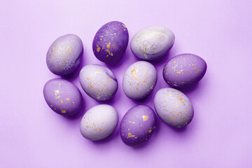Easter frame of eggs painted in purple color. Flat lay, top view. Copy space for text.