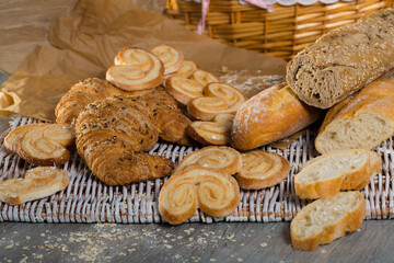 Image of various kinds of bread and bakery products on table