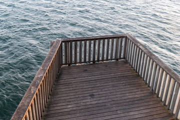 Wooden pier on top of water.