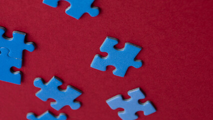 scattered puzzle pieces on colored background