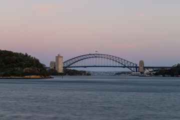 Sunset view of Sydney Harbour Bridge.
