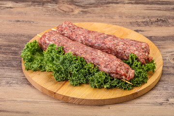 Raw minced beef kebab skewer