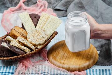 Cracker and cookies with a jar of milk