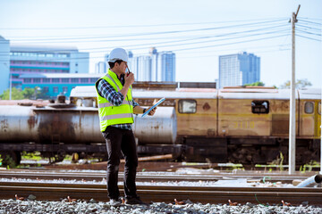 Portrait engineer under inspection and checking construction process railway and checking work on...