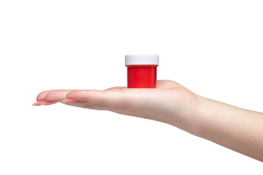 Gouache can in female hands isolated on white background