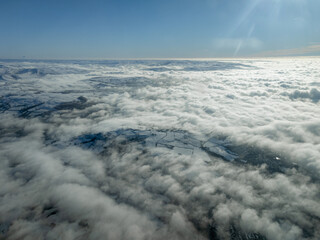 Aerial winter view of clouds on a foggy, misty, snowy morning in the UK